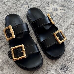 Schutz Black Sandals with Gold Buckles